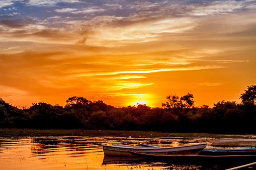 Sunset with fishermen's boats at Orinoco River, Caicara, Venezuela
