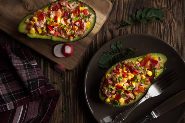 istock Avocado halves stuffed with tuna fish and vegetables 1273479569