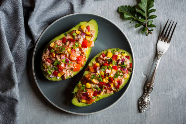 istock Avocado halves stuffed with tuna fish and vegetables 1273480296