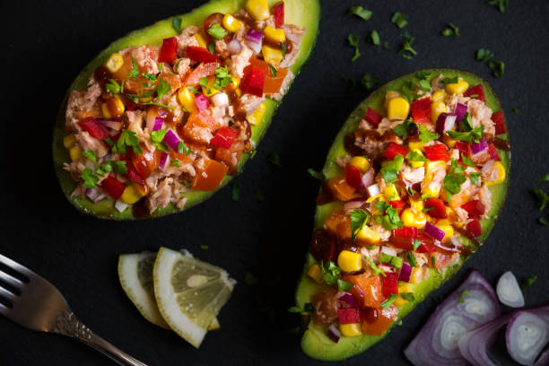 istock Avocado halves stuffed with tuna fish and vegetables 1273480322