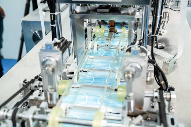 istock Face mask production line in modern factory 1273480328