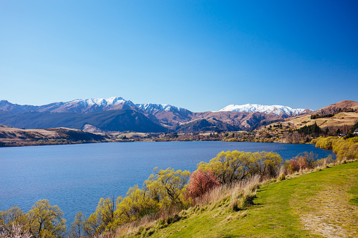 View over Lake Hayes from Lake Hayes Showground on a clear spring day in Otago region of New Zealand