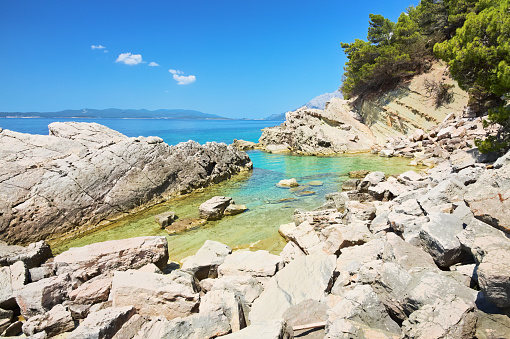 Empty beach and crystal clear water in the Adriatic Sea. South of Croatia - Peliesac peninsula.