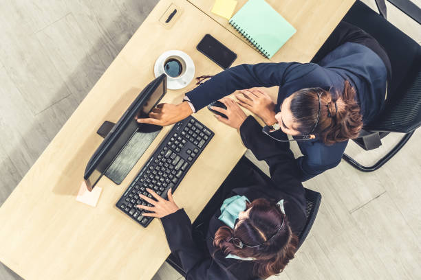 istock Business people wearing headset shot from top view 1273482944