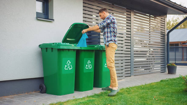 istock Caucasian Man is Throwing Away Plastic Bags with Sorted Trash. Concept of waste sorting for food, paper and bottles. Saving Environment from Trash. 1273484319