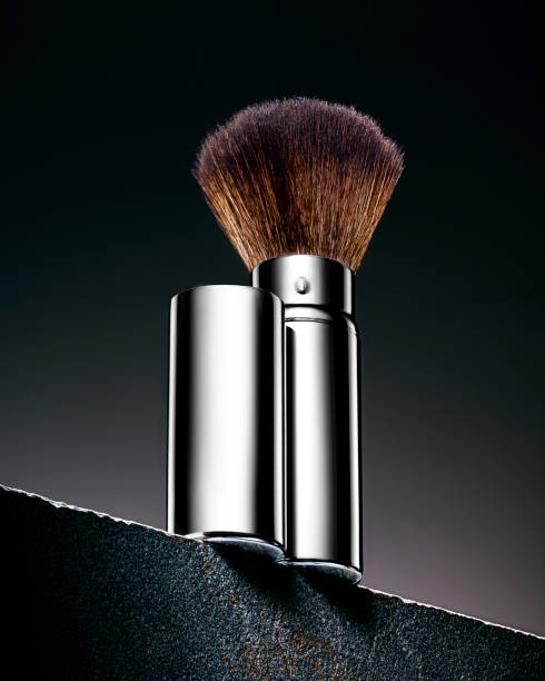 istock Cosmetics brush standing on a tilted stone legde 1273485546