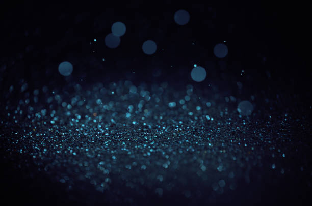 istock Blue romantic sparkling abstract bokeh on black background. Holiday and magic concept. 1273486958
