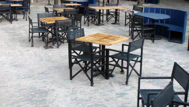 istock Scene Of Empty Outdoors Restaurant Chairs 1273487255