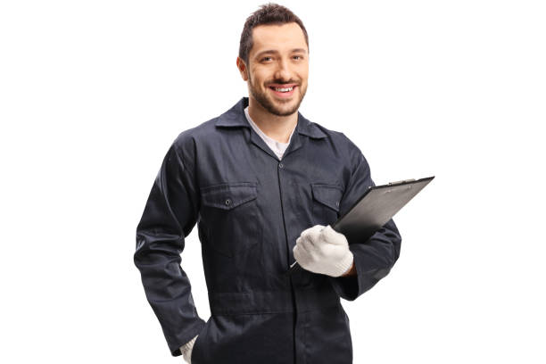 istock Auto mechanic holding a clipboard and smiling at the camera 1273488808