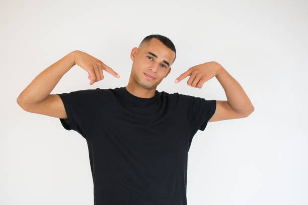 istock Young man over isolated background looking confident with smile on face, pointing oneself with fingers proud and happy 1273489882