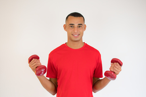 Young man with dumbbells