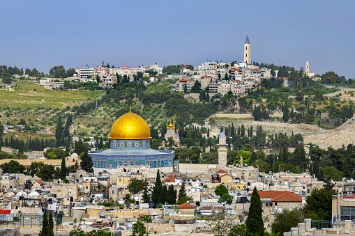 East Jerusalem, Palestine, May 2, 2019: View of the Dome of the Rock on the Temple Mount. In the background is the bell tower of the Russian church (the bigger one).