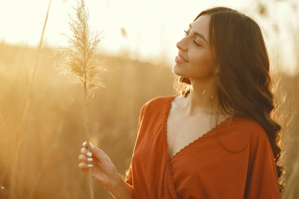 istock Stylish woman spending time in a summer field 1273491215