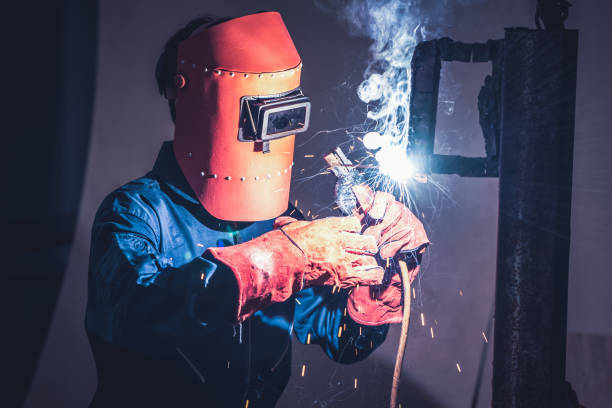 istock Metal welding steel works using electric arc welding machine 1273491246