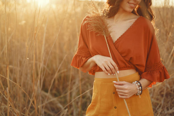 istock Stylish woman spending time in a summer field 1273491290