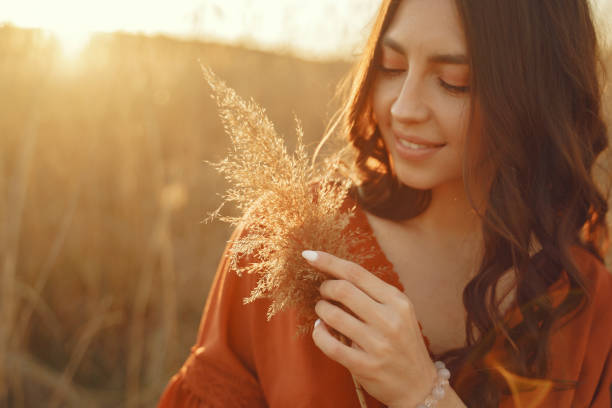 istock Stylish woman spending time in a summer field 1273491309