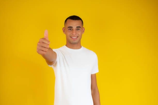 istock Happy handsome man showing thumbs up 1273491336