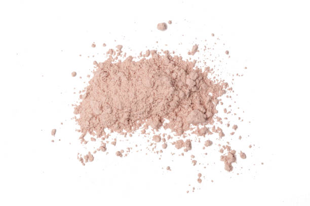 istock Beige cosmetic or make up powder isolated on white. 1273492345