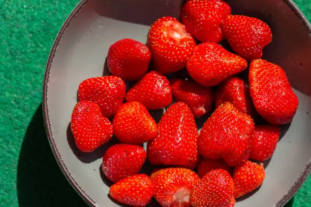 a bowl of fresh strawberries with view from above