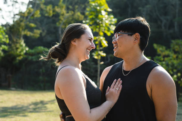 istock Smiling couple in nature park 1273493202