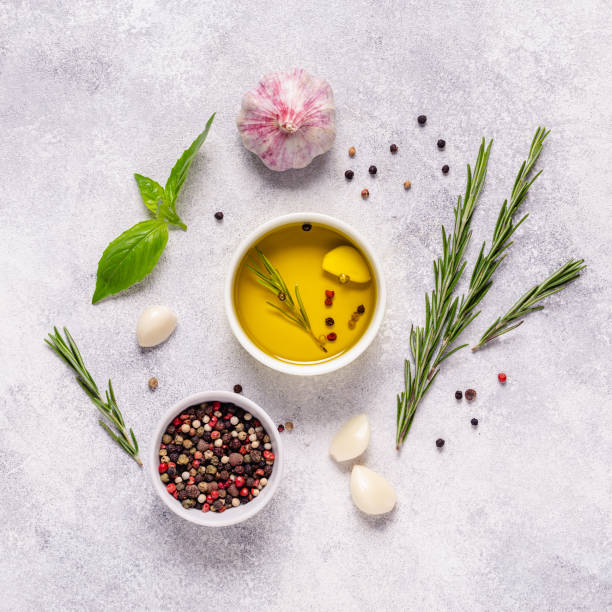 istock Herbs and condiments on light stone background. 1273493360