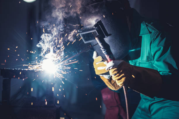 istock Metal welding steel works using electric arc welding machine 1273494790
