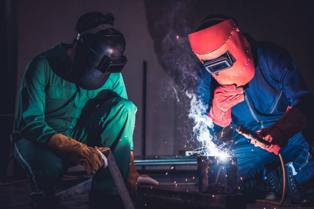 istock Metal welding steel works using electric arc welding machine 1273498011