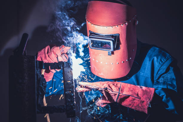 istock Metal welding steel works using electric arc welding machine 1273504937