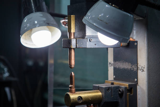 istock close-up view of spot welder tips device with two lamps 1273505821