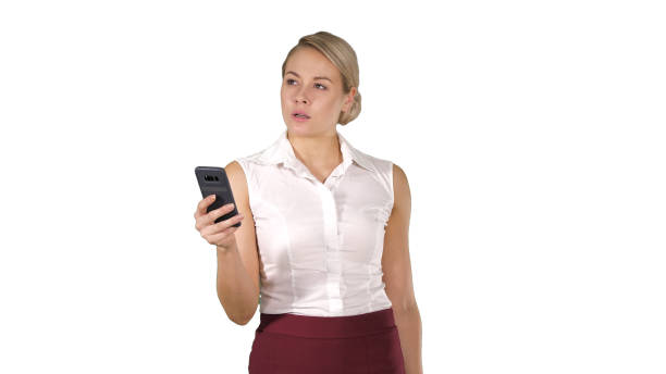 istock Young woman looking at smartphone thinking and reading on white 1273506829
