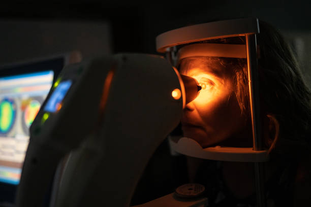 istock Mature woman doing an eye test 1273506970