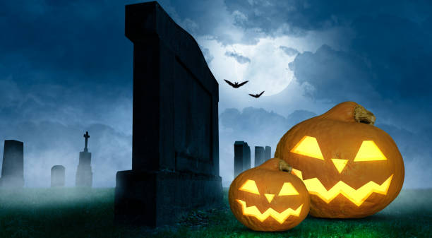 istock scary halloween background with grinning pumpkins in background 1273507122