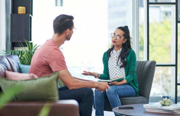 There's a time for talking and a time for action Shot of a young man and woman having a discussion in a modern office career counseling stock pictures, royalty-free photos & images