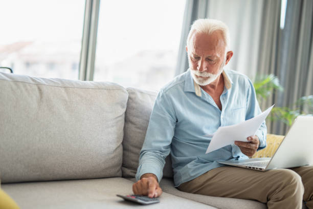 istock Senior man taking care of bills 1273512360