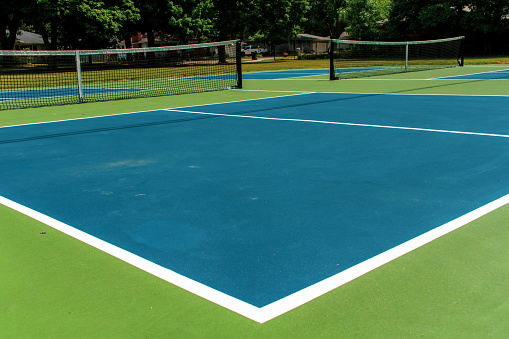 Tennis balls on the tennis court. Tennis ball out of tennis court. Tennis game.
