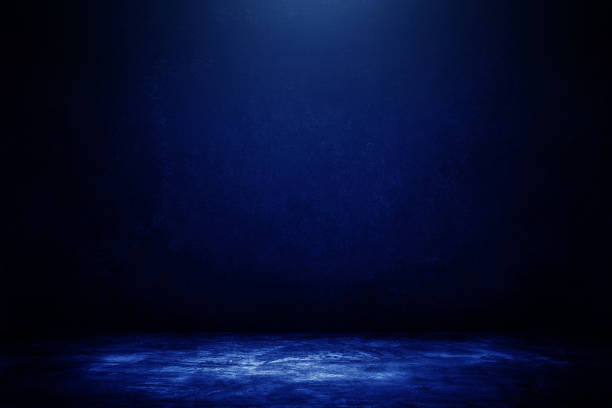 istock Studio dark room concrete floor texture background with blue lighting effect. 1273515458