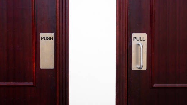 Push and pull sign on a door at a apartment.
