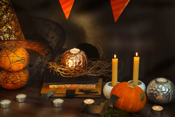 istock pumpkins and candles, black magic 1273520724