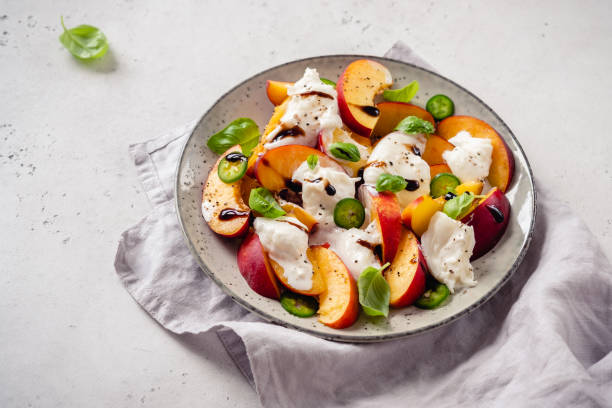 istock Fresh salad with Peaches and Buratta cheese 1273526404