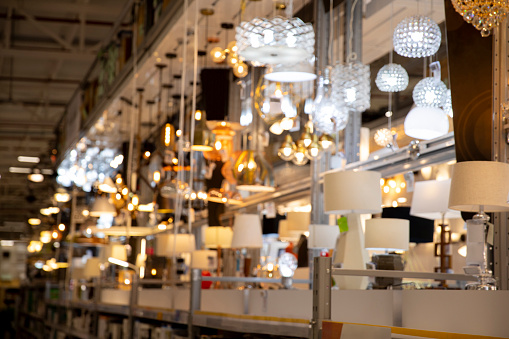 Blur lamps in a big warehouse. a lot of luxury lamps and chandelier night scene