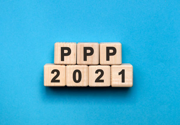 istock PPP - text concept on wooden cubes with gradient blue background 1273529650