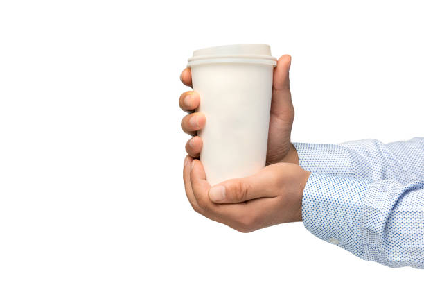 istock Man holding out a paper cup of coffee on white background 1273531205