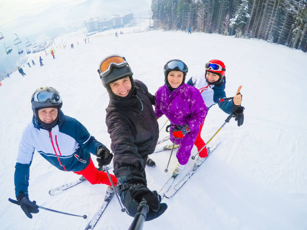 istock Group Of Middle Aged Couples On Ski Holiday In Mountains 1273532189