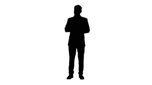 istock Concentrated young man in formalwear holding note pad and writin 1273532928
