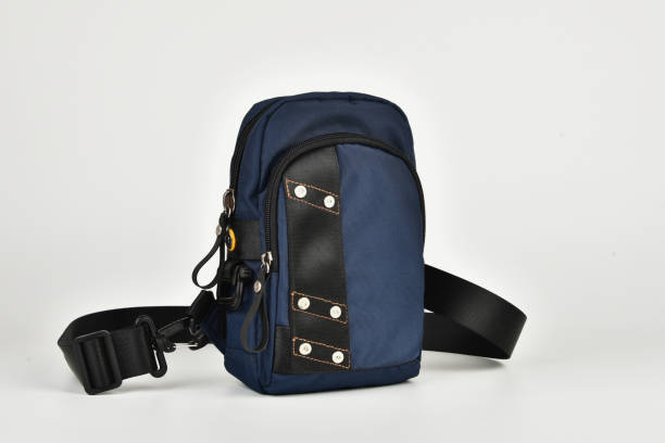 istock A small shoulder bag for documents and small items on a white background. A must have accessory for travel. 1273533445