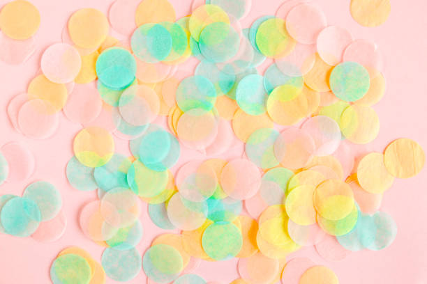 istock Colorful paper confetti on pink background. Celebration concept. Flat lay. Top view 1273536523