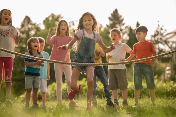 istock Group of kids have fun in public park 1273536554