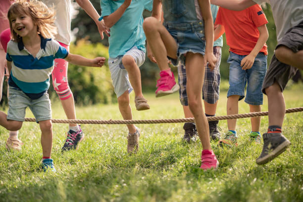 istock Kids jumping over a rope 1273537189
