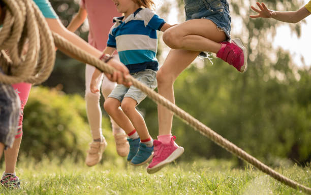istock Children jumping over a rope 1273537223
