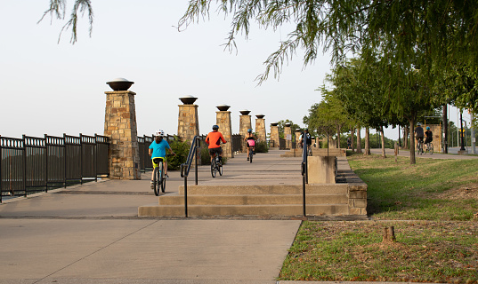 Dallas, TX / USA - August 20, 2020: People ridding bike in the White Rock Lake in summer